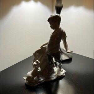 Lladro boy w/ dog sculpture